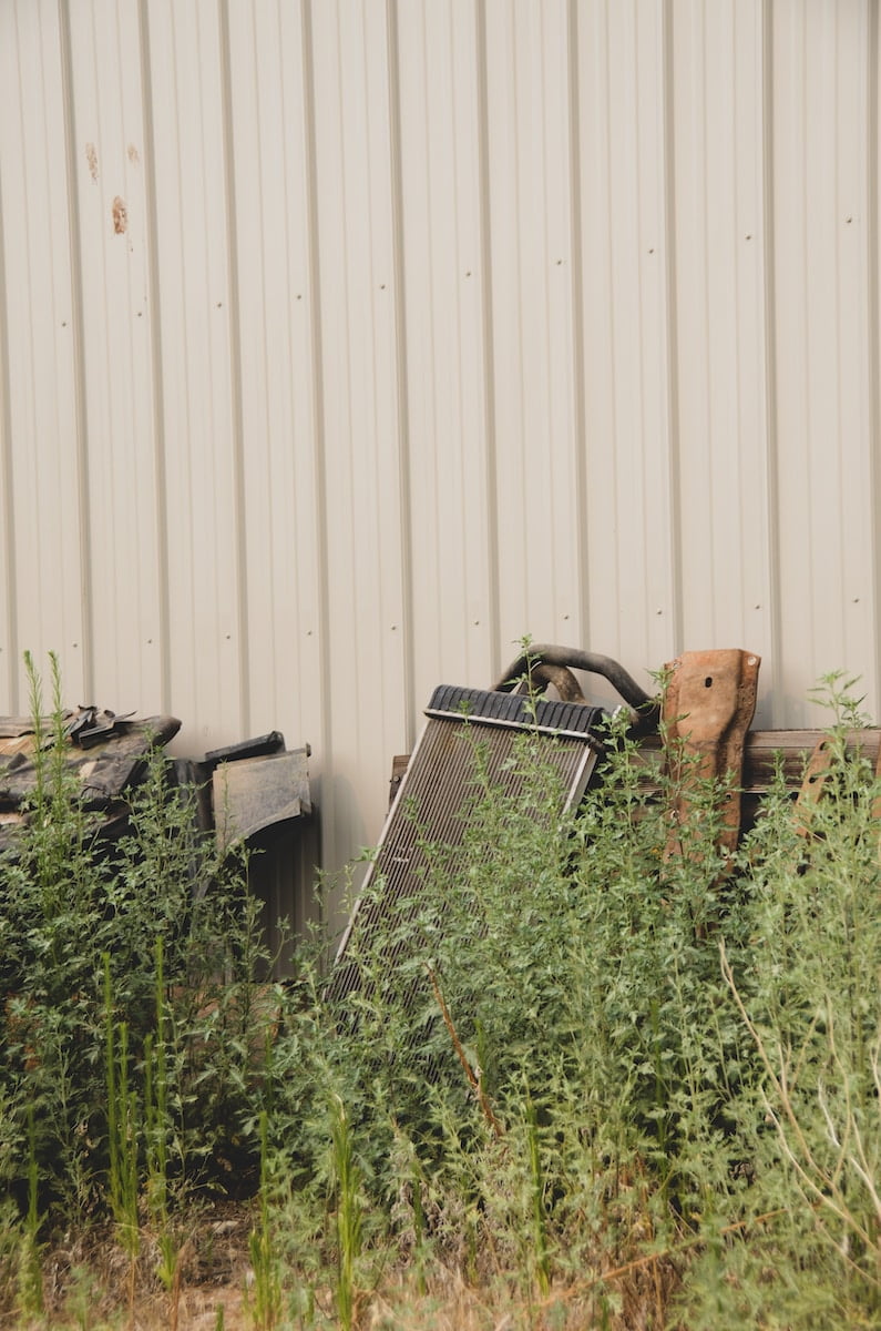 Old equipment and yard debris requiring cleanup services